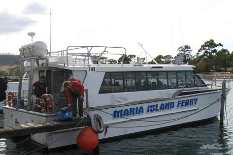 A ferry boat, moored at jetty.