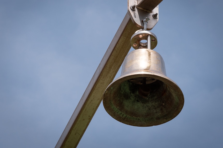 church bell hangs on structure