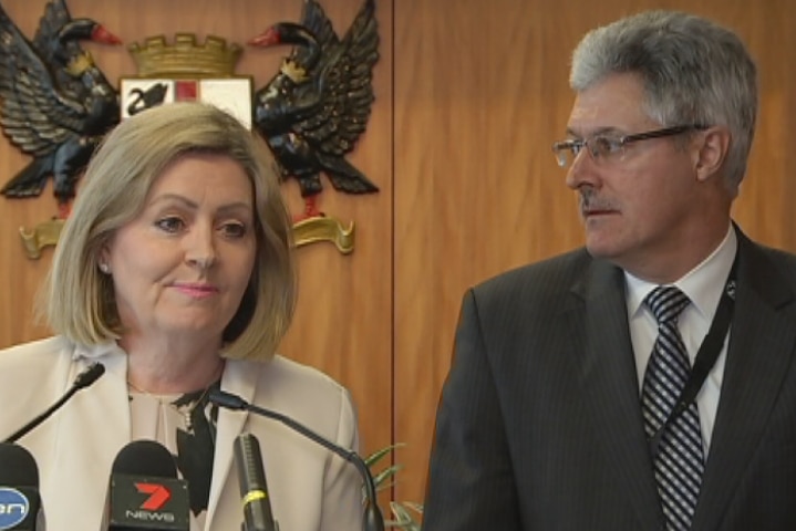 Lord Mayor Lisa Scaffidi speaks at a press conference at Council House with Robert Mianich next to her.