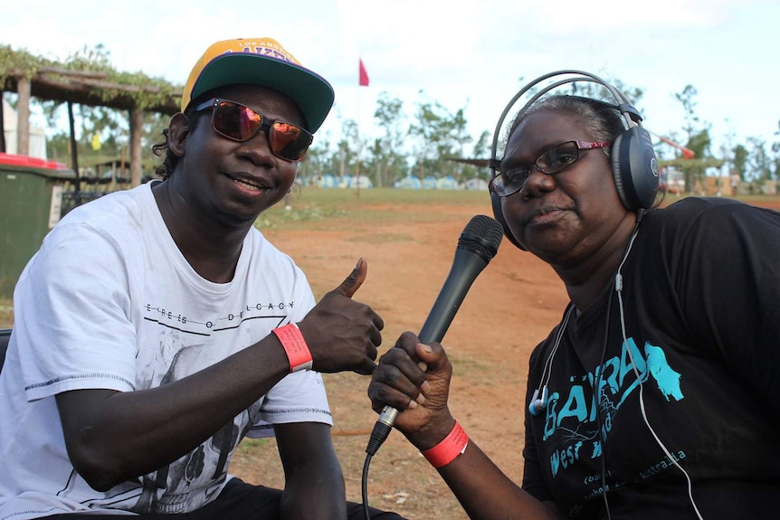 Ms Nulpinditj doing an annual, live outside broadcast at Garma Festival.