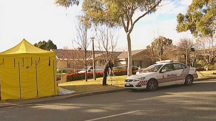 Police and emergency personnel attend a murder at a Red Hill house a house on Mugga Way, Canberra on July 23, 2012.