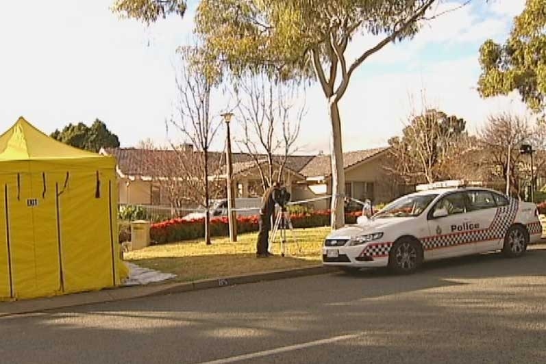 Police and emergency personnel attend a murder at a Red Hill house a house on Mugga Way, Canberra on July 23, 2012.