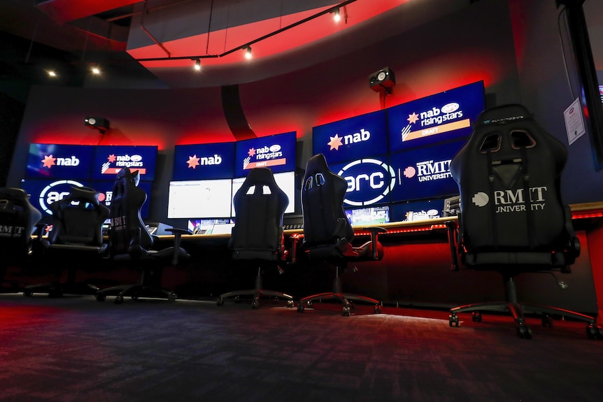 A wide angle shot of the AFL's score review centre featuring executive chairs and high resolution TV screens