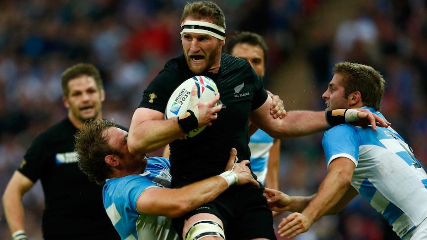 Kieran Read fends off Argentina tackles