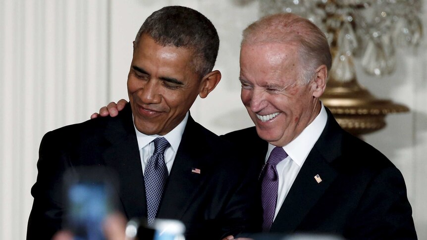 President Barack Obama and Vice President Joe Biden embrace at the White House.