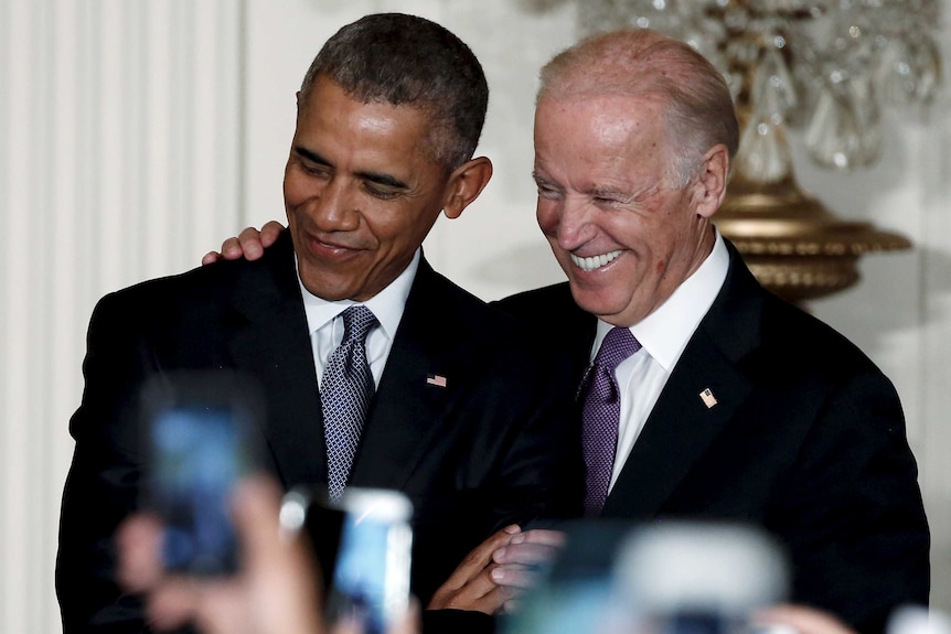 President Barack Obama and Vice President Joe Biden embrace at the White House.