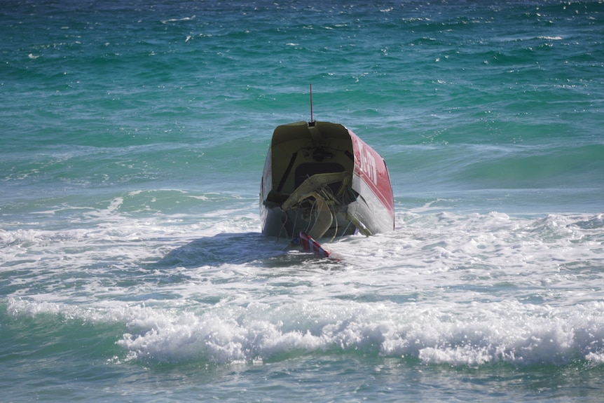 Wreckage from a plane in the surf.