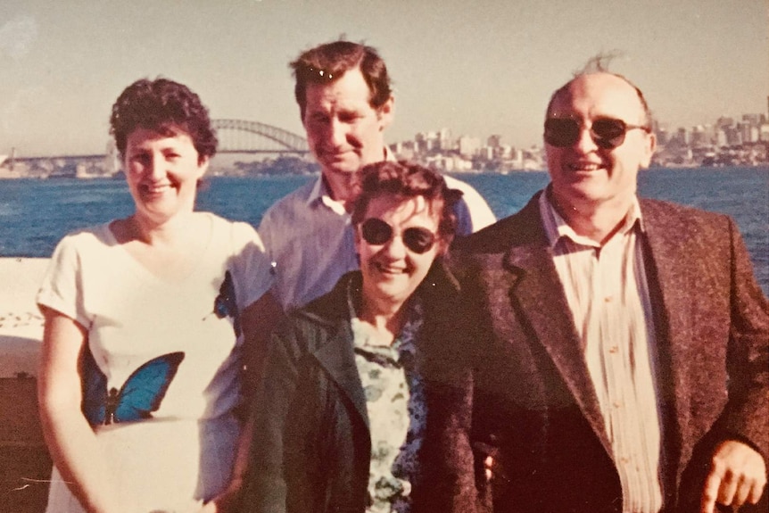 Two women and their husbands stand in front of the Sydney Harbour Bridge circa 1988.