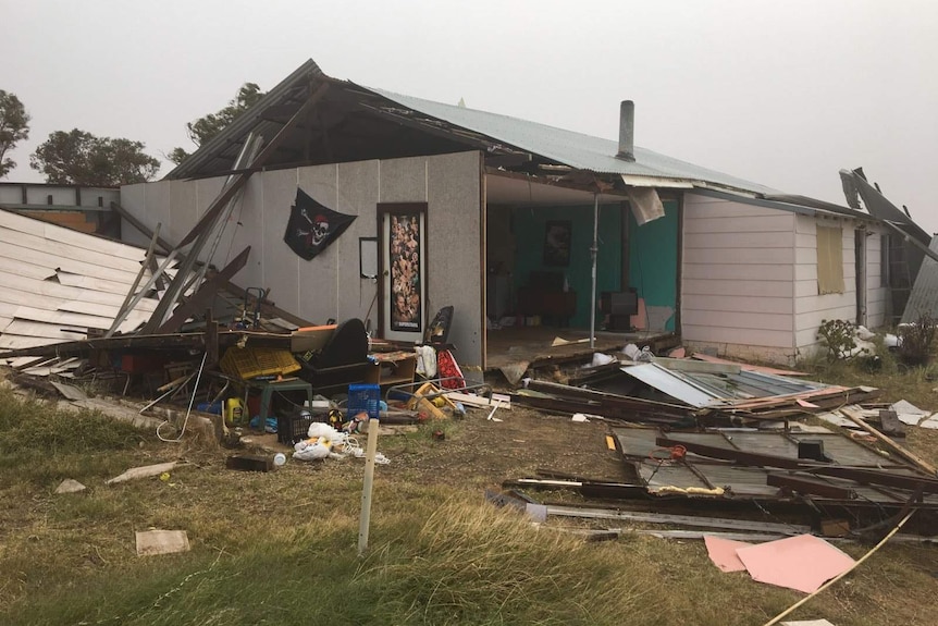 The exterior of a house exposed after strong winds destroyed the walls and roof