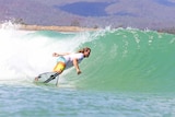 Mark Occhilupo surfs a wave at a man made wave pool.