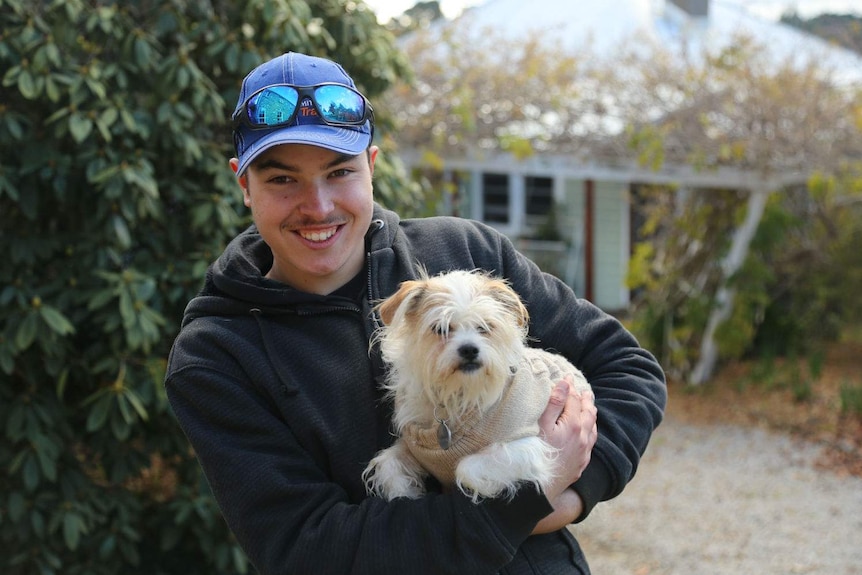 A boy with his dog.