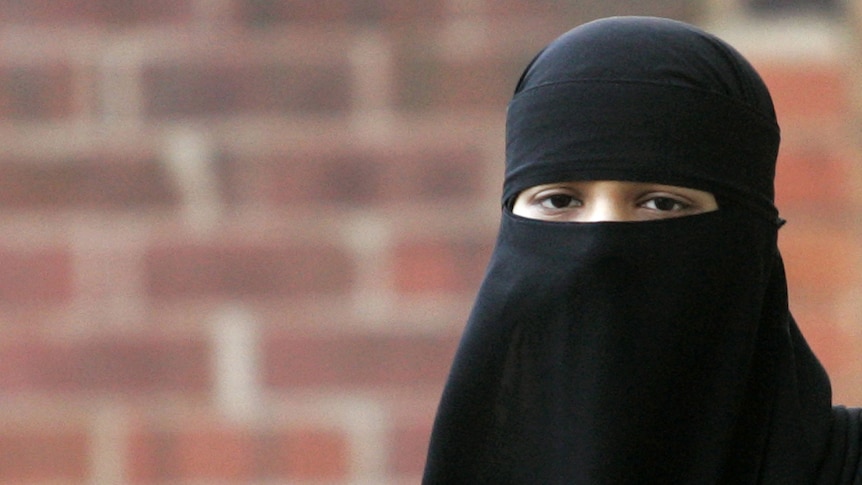Asma Patel, a local Muslim in Britain, wears a veil known as a niqab