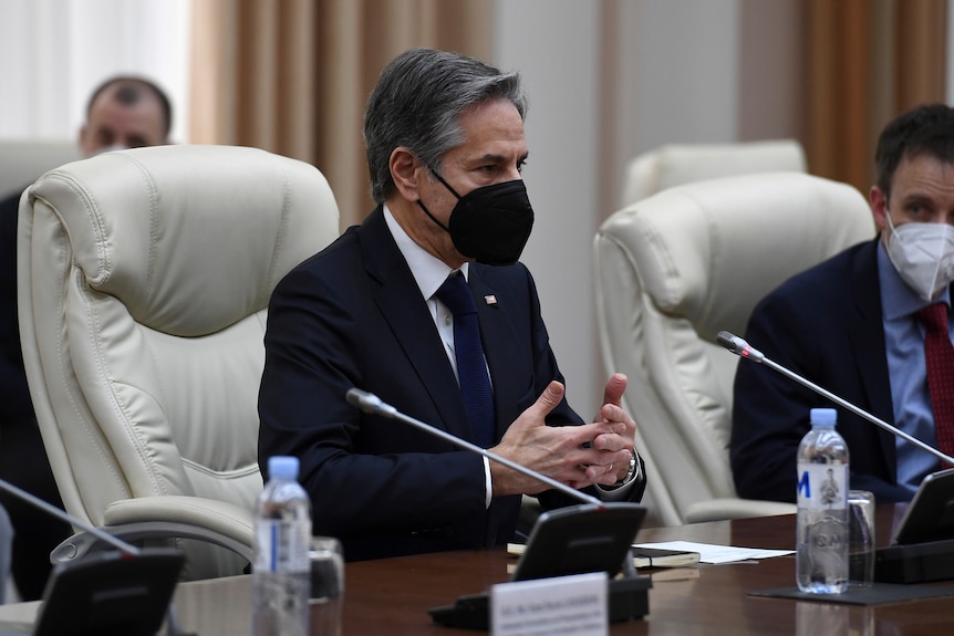US Secretary of State Antony Blinken speaks with a mask on during a meeting with Moldovan Prime Minister Natalia Gavrilita