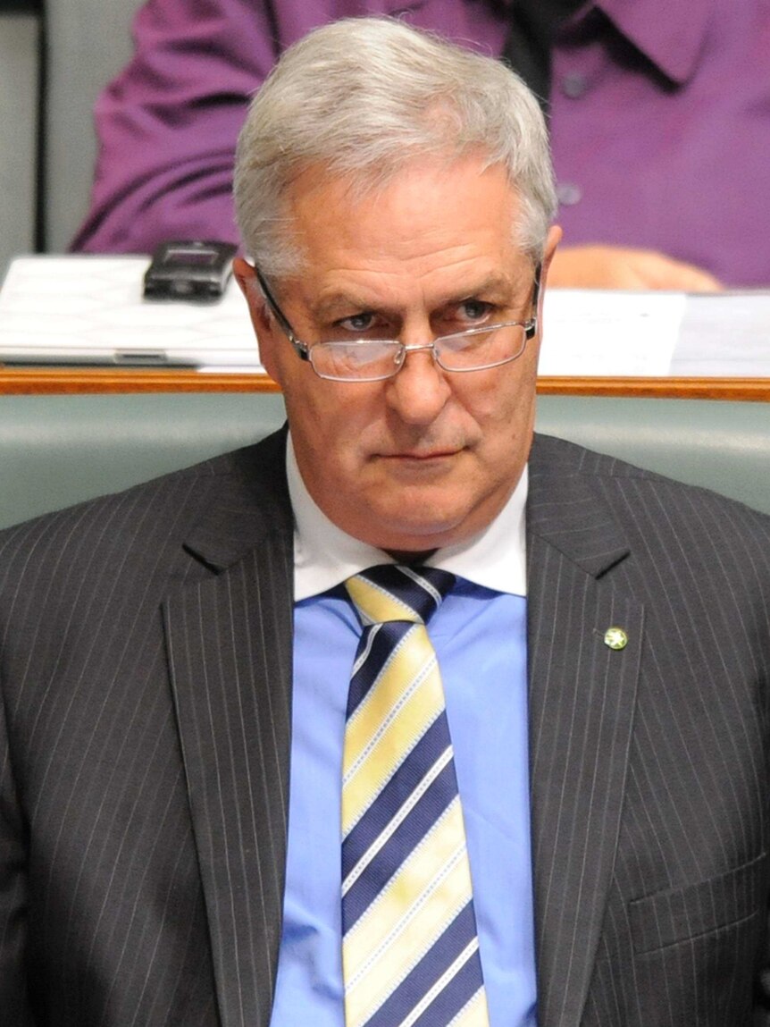 Don Randall listens during question time in the House of Representatives.