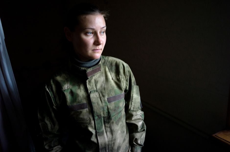 Alla (31), an actress turned volunteer soldier, in the frontline house she shares with 20 male comrades.