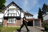 British police at a residential address believed to be the British home of the Hilli family.