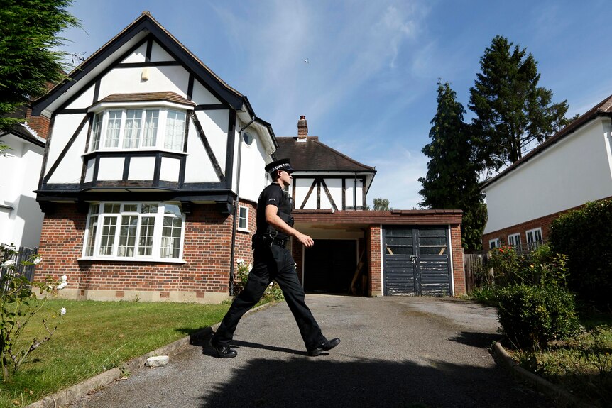 British police at a residential address believed to be the British home of the Hilli family.