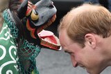 Britain's Prince William greeted by a lion dance