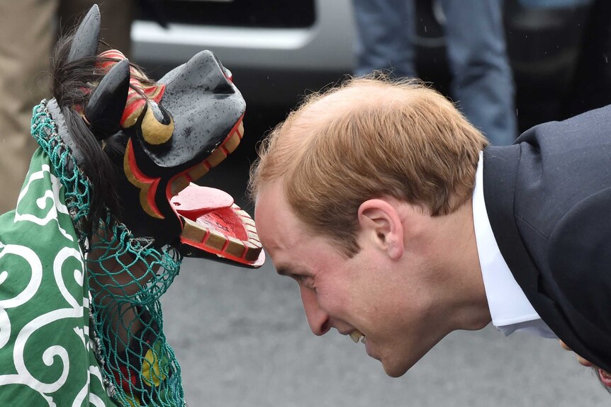 Britain's Prince William greeted by a lion dance