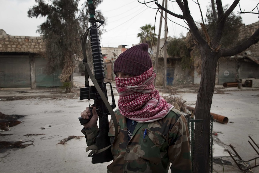 A masked Syrian Turkmen rebel
