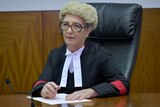 a female supreme court justice sitting in robes and a wig
