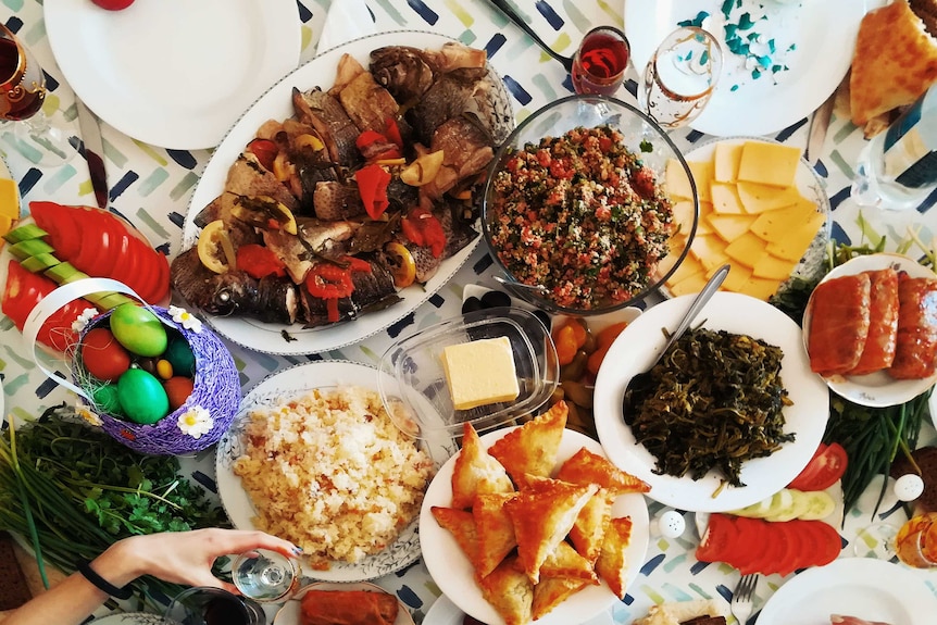 Aerial photo of an Easter feast with eggs and cooked dishes.