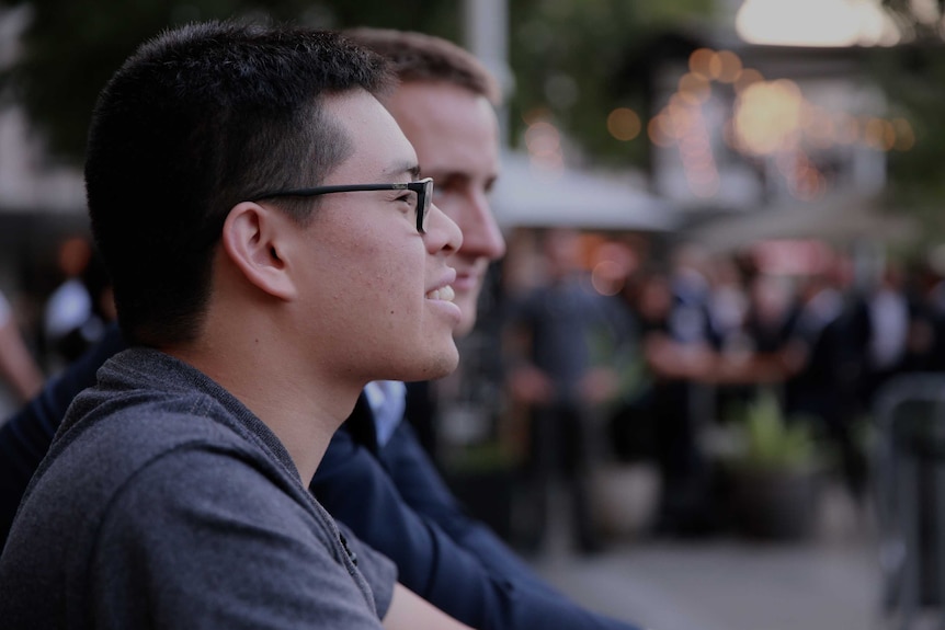 A profile picture of Will Curtis in the foreground and David Lawrence-Watt out of focus behind him.