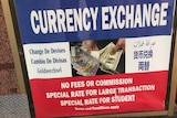 Sign outside a money exchange bureau.