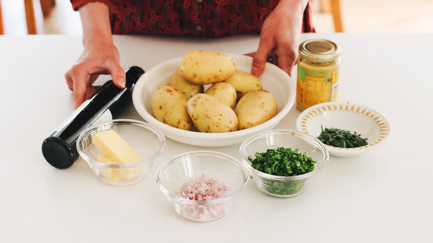 Olive oil, butter, shallots, chives, mustard and potatoes, ingredients for potato salad, a summer side for feasts.