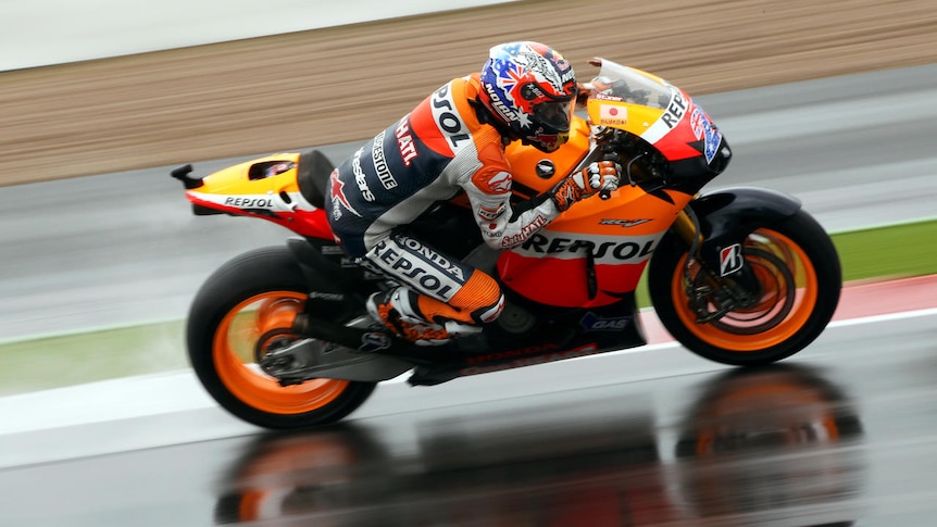 Stoner wins at wet Silverstone