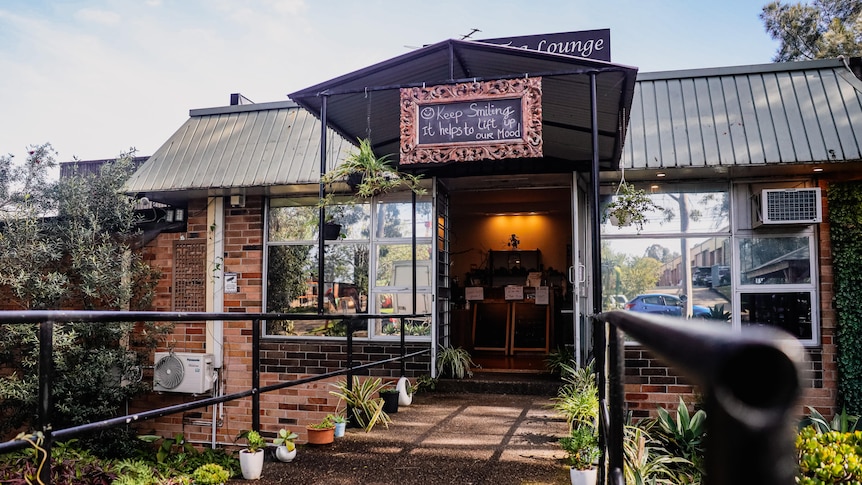 A cafe with a sign saying Zen Tea Lounge