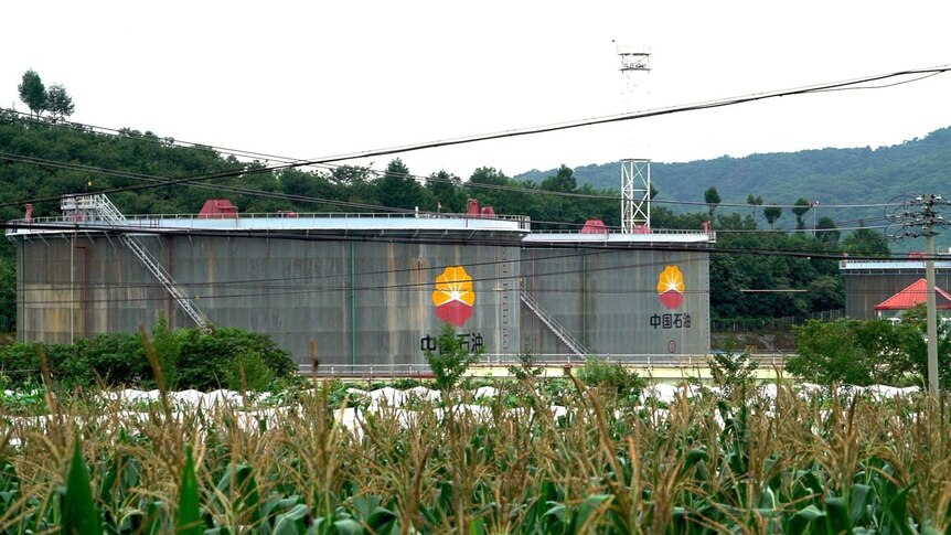 Two large oil storage tanks can be seen at an oil storage facility in China near the North Korea border.