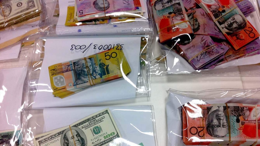 Bundles of cash seized in police operation