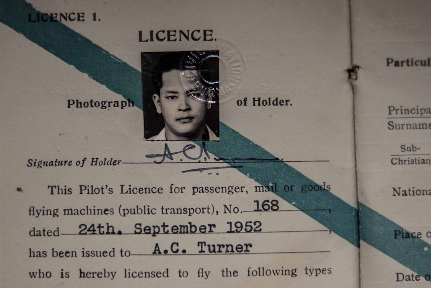 A document certifying a pilot's licence to fly certain aircraft, including his photograph and signature.  