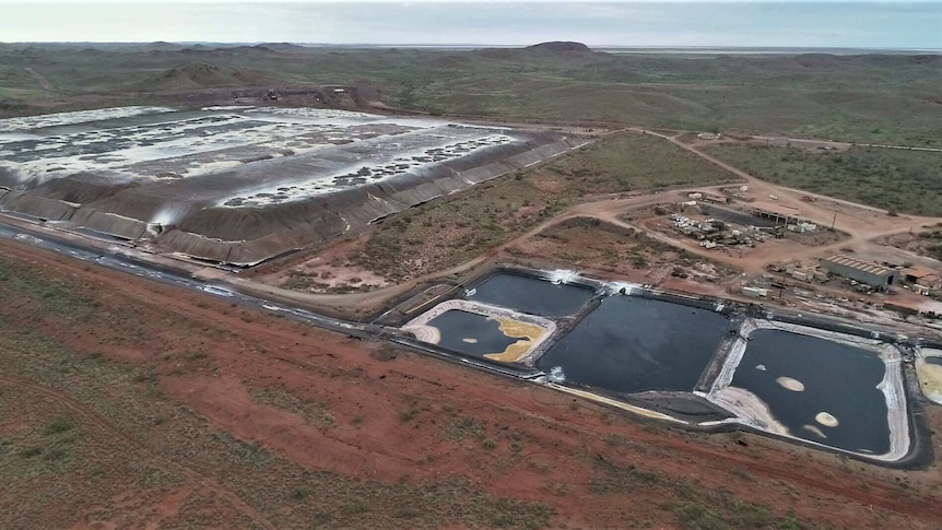 An aerial shot of an outback mine project showing man-made ponds
