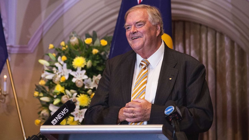 A smiling Kim Beazley stands at a podium, speaking about his appointment as WA's next Governor.
