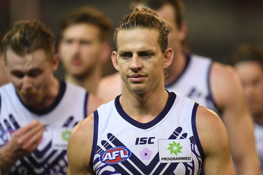nat fyfe walking off the field with the Dockers.