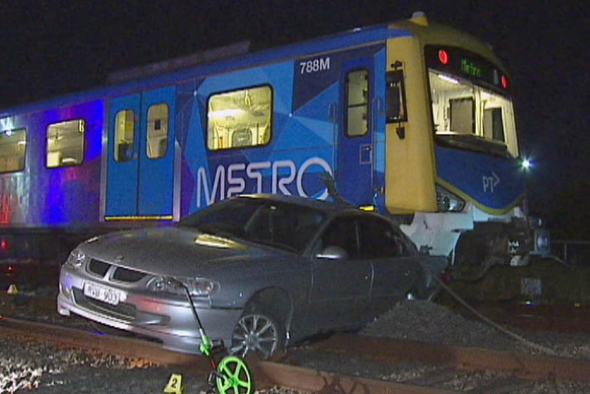 Car stuck under Metro train after being hit on rail tracks