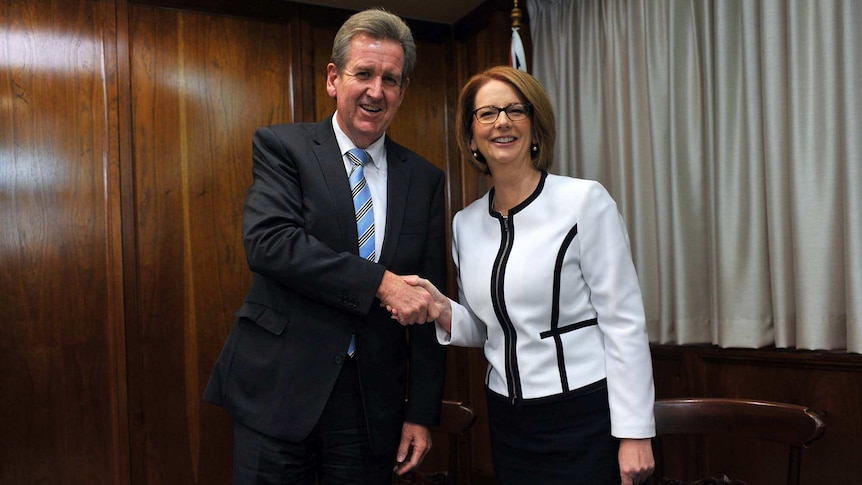 Julia Gillard and Barry O'Farrell shake hands