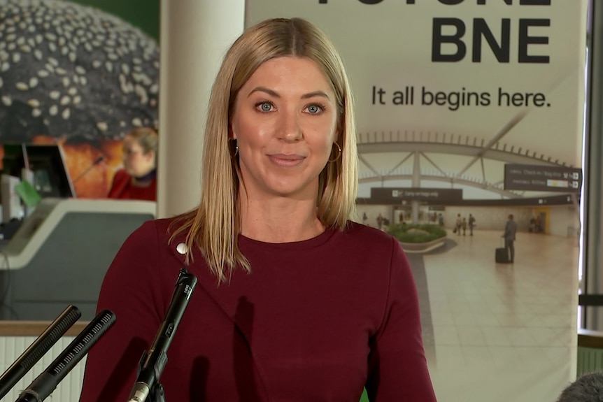 Stacy Pollard stands in front of a Future BNE sign