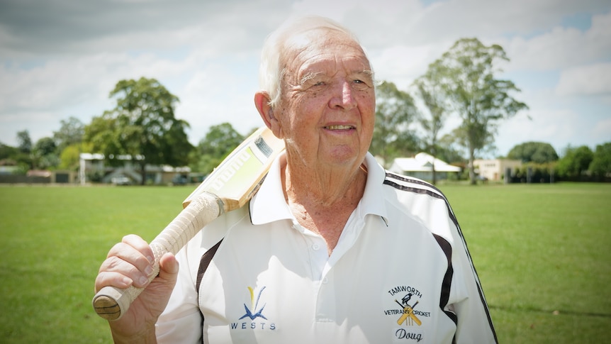 Doug Crowell holding cricket bat