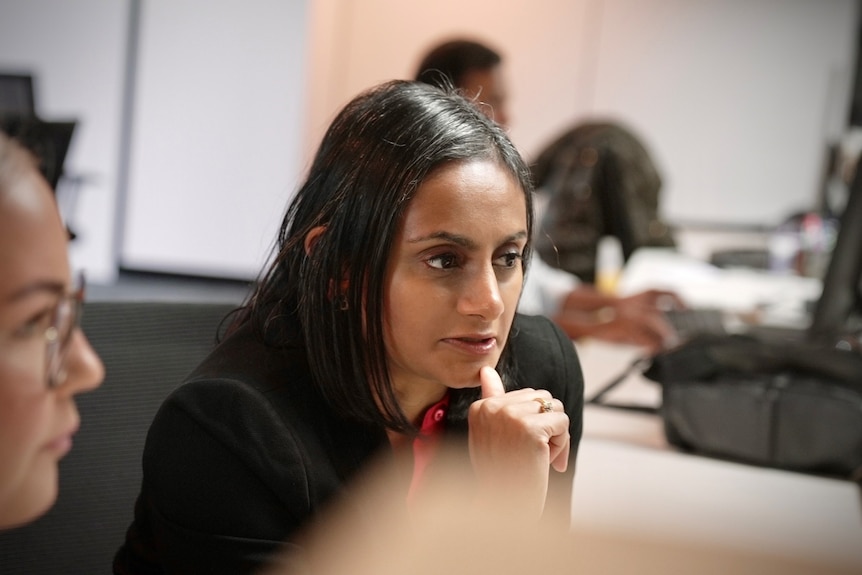 a woman in a boardroom