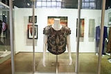 A torso from a Gladiator movie costume worn by Russell Crowe is seen on display.