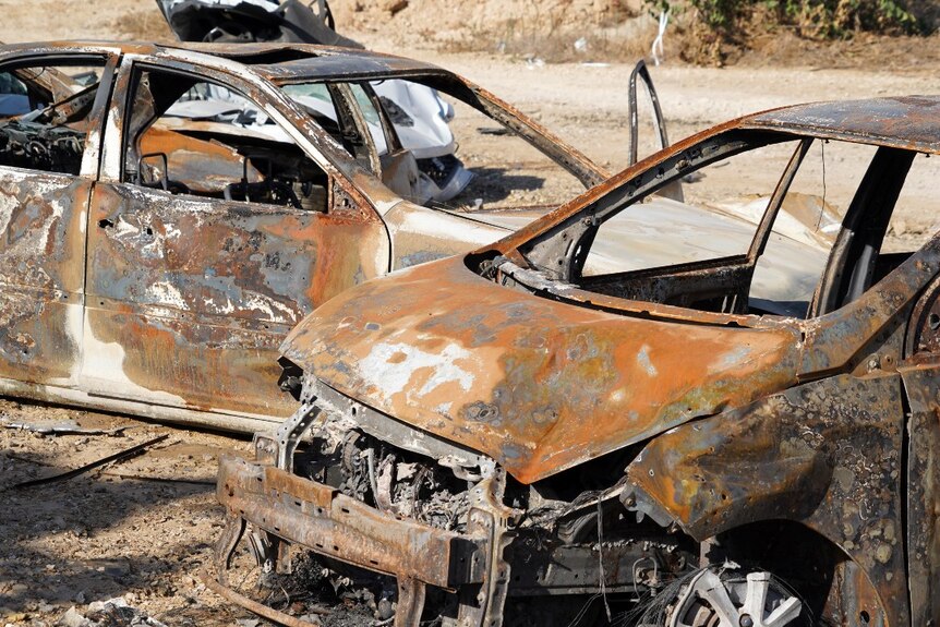 The shells of two burnt cars