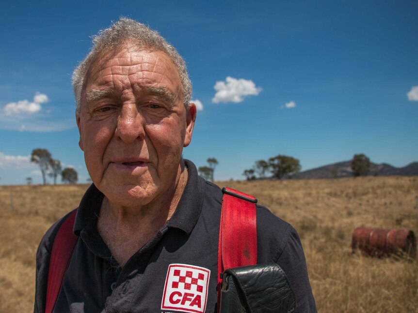 Little River CFA Captain Terry Head in front of a dried out paddock.