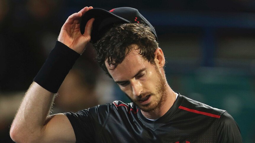 Andy Murray reacts after losing a match in Abu Dhabi