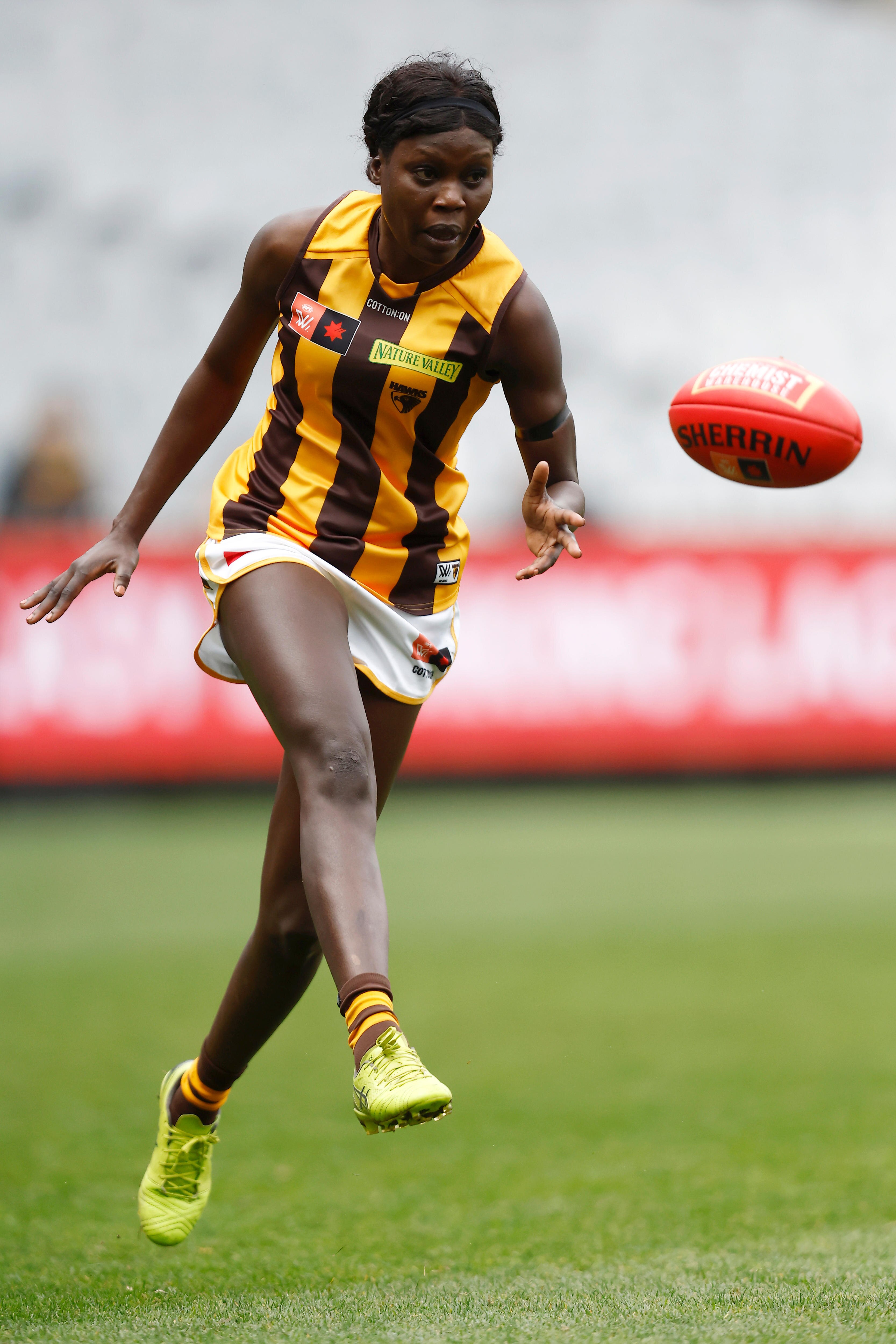 Akec Makur Chuot of Hawthorn kicks the ball during the AFLW Practice Match between the Richmond Tigers and the Hawthorn Hawks