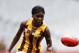 Akec Makur Chuot of Hawthorn kicks the ball during the AFLW Practice Match between the Richmond Tigers and the Hawthorn Hawks