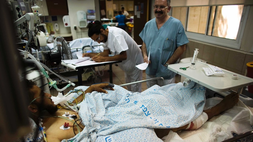 A wounded Syrian man receives treatment at Ziv Medical Centre in Israel