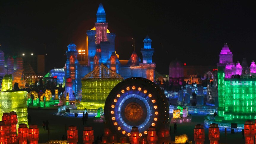 Ice sculptures are illuminated by coloured lights at the Harbin International Ice and Snow Festival.
